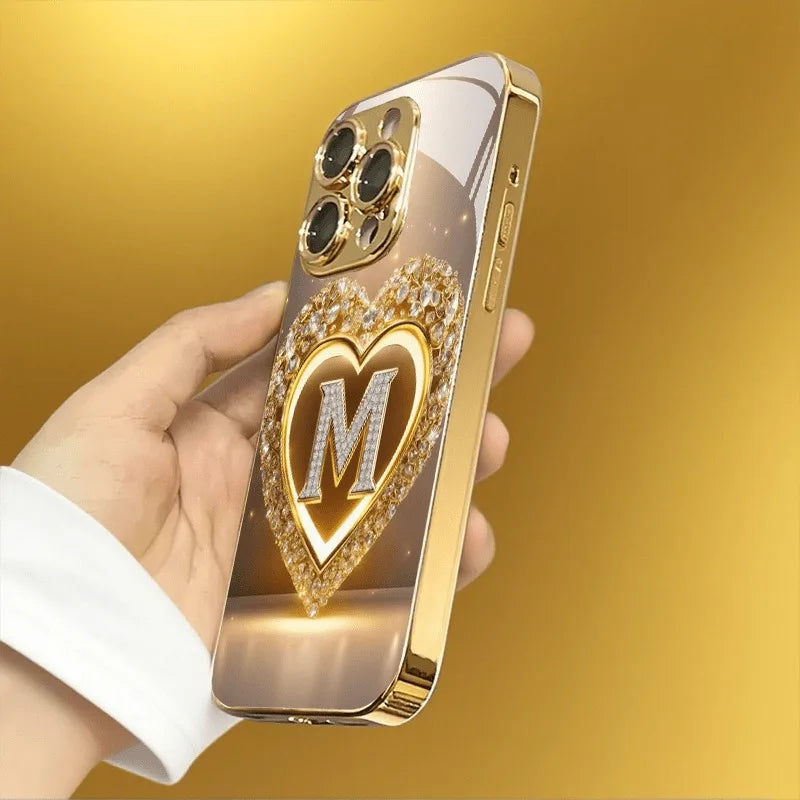 Sparkling Heart Letter M Metallic Glass Phone Case for iPhone 17, 16, 15, 14, 13, 12, 11 Pro Max, Plus, 17 Air, 16E Cover